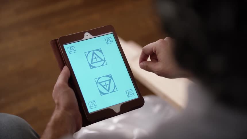 A man is using a tablet