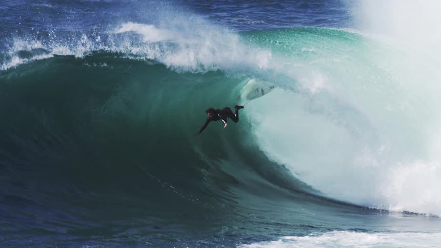 Surfer falling from board