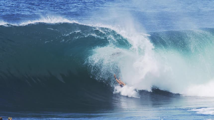Surfer falling on a wave in the ocean