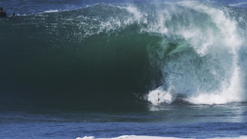 Surfer riding wave