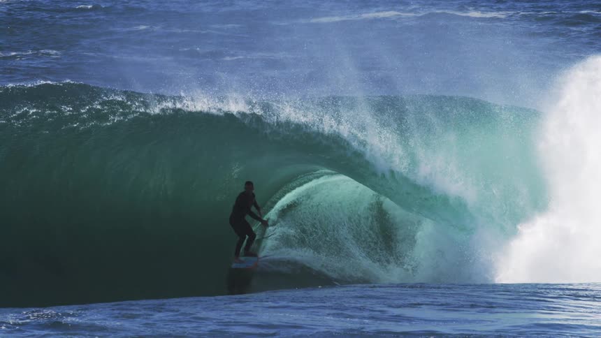 Surfer inside a tubular wave