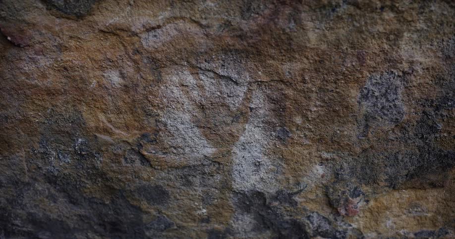 Abstract handprint on a rock