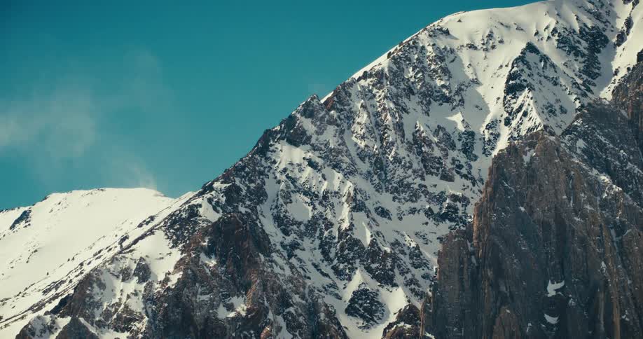 Snowy cliff mountain