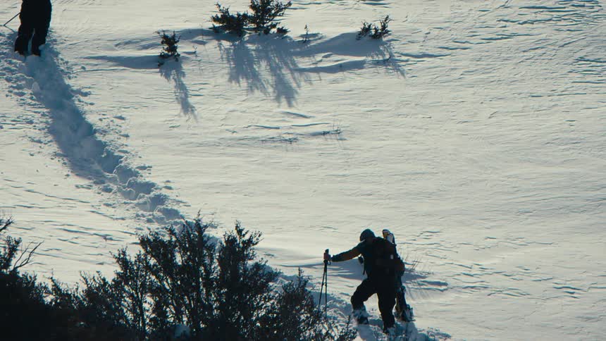 Person snowboarding on a snowy mountain