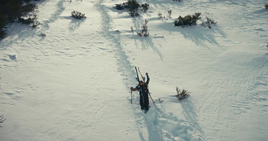 Skier climbing a snowy mountain