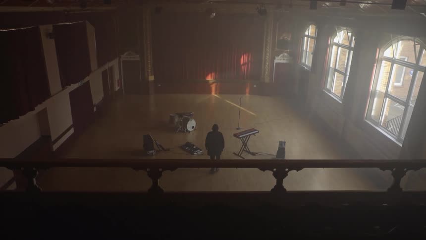 Person walking towards instruments