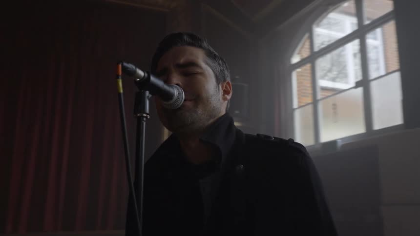 Man singing into a microphone