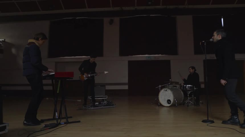 Group of four men in a musical rehearsal