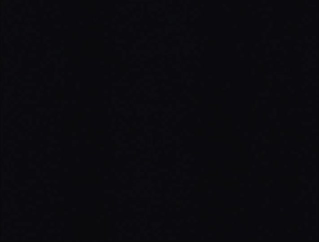 A footage of people sitting on the bed on a stormy night