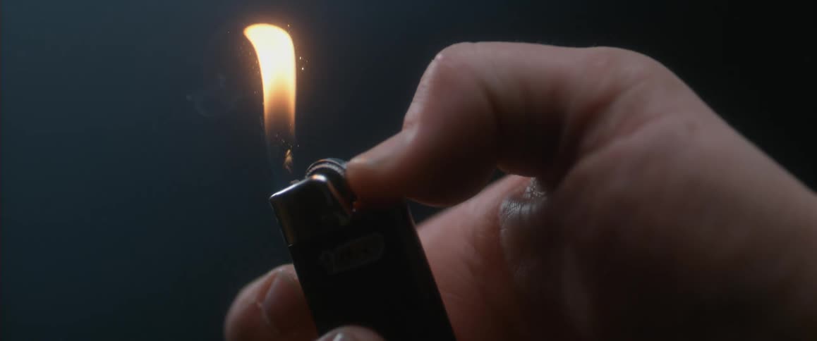 A person sparking a lighter