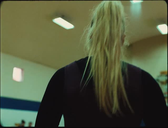 A woman walking in a gym