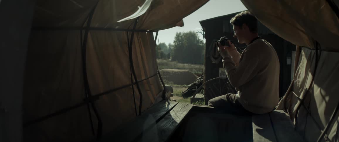 Man sitting in a carriage and taking pictures