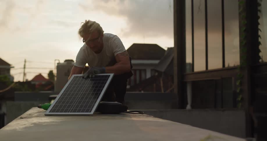 Man working with a solar panel