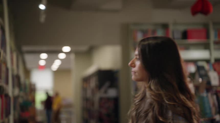 Woman looking at books
