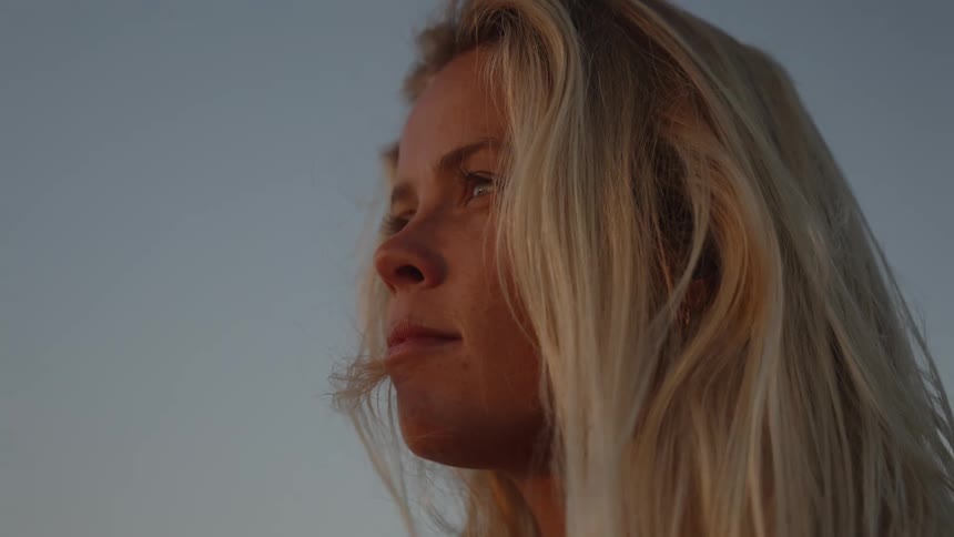 A woman looks into the distnace