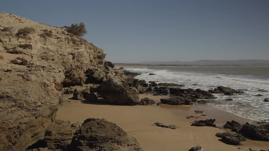 Water flowing into beach