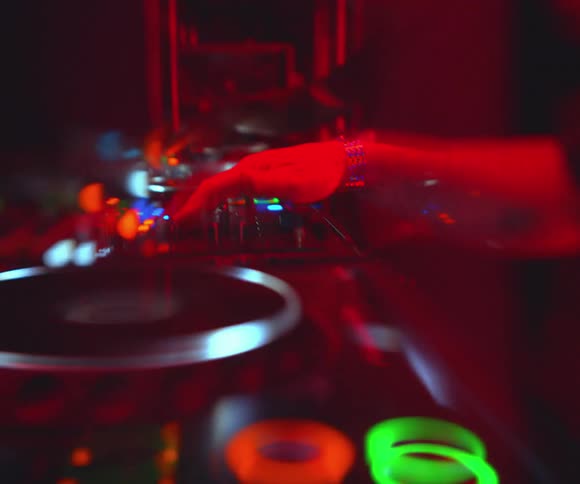 The dj is playing music in the club