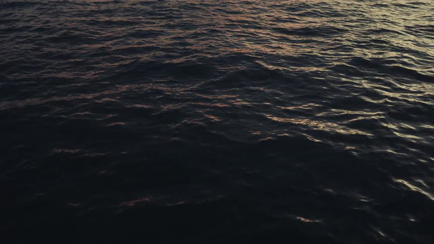 Lake rippling with the wind at dusk