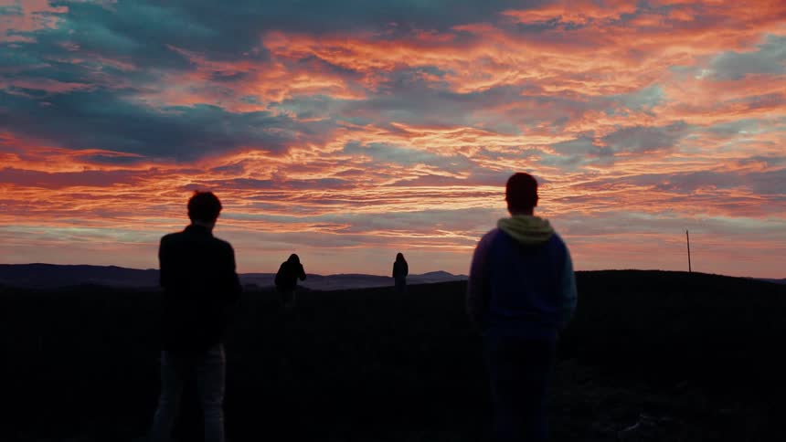 People are watching the sun set together
