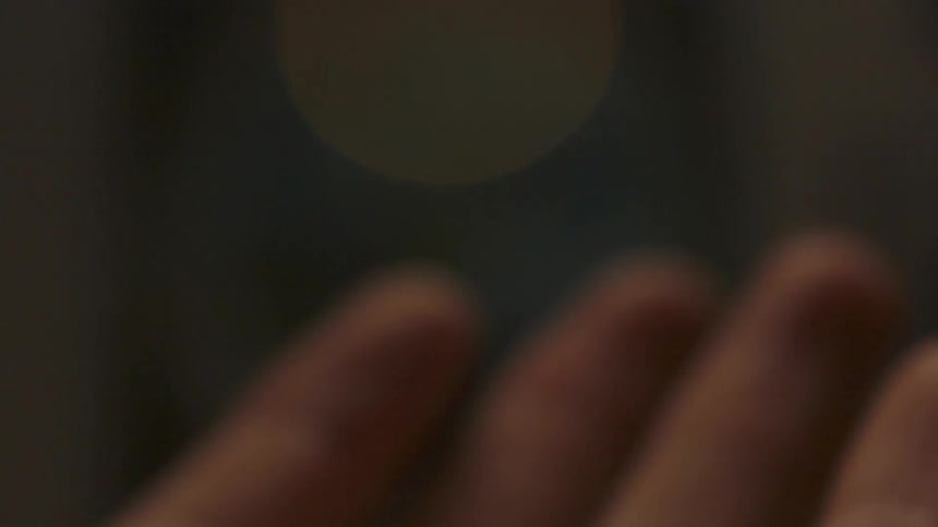 Light slowly covers a hand