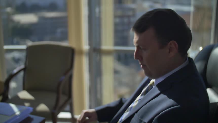 Man sitting down at a desk