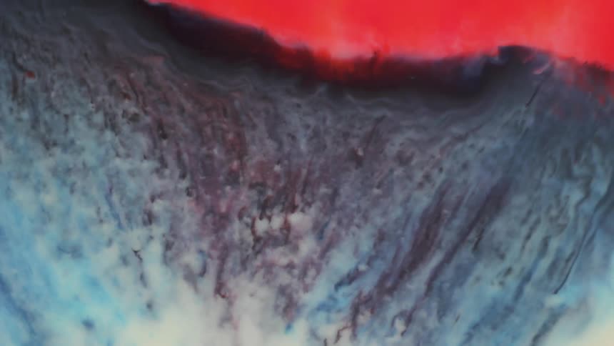 A colorful palette of red, blue, and white spreading out