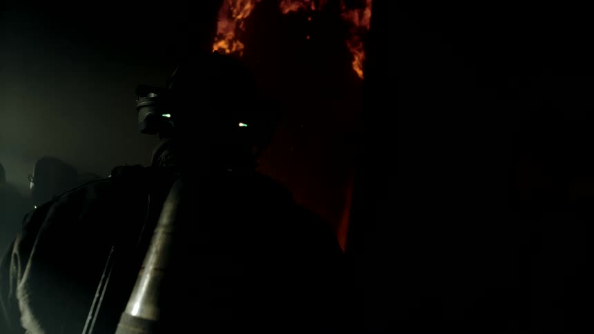 A building is on fire at night