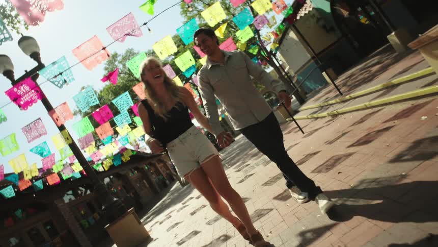 Couple holding hands walking