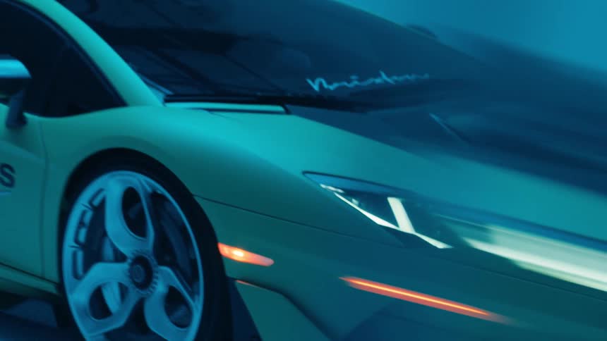 Flashing blue lighting intermittently illuminates a parked sports car