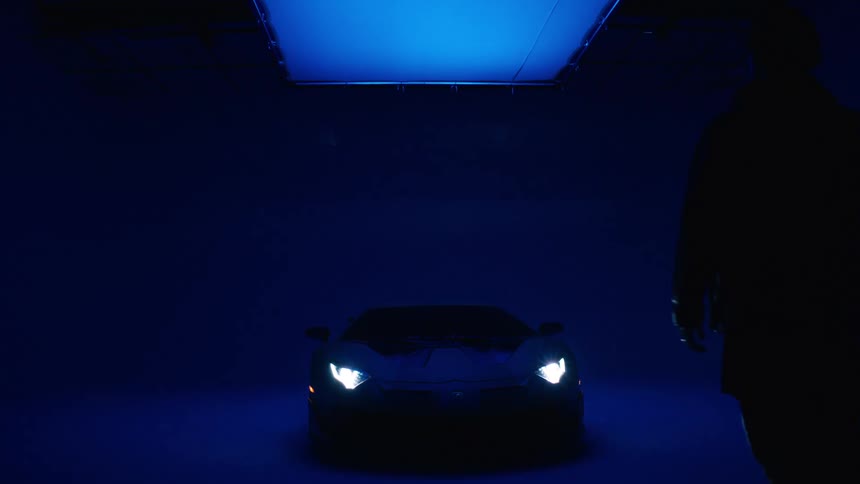 A man walks towards his car
