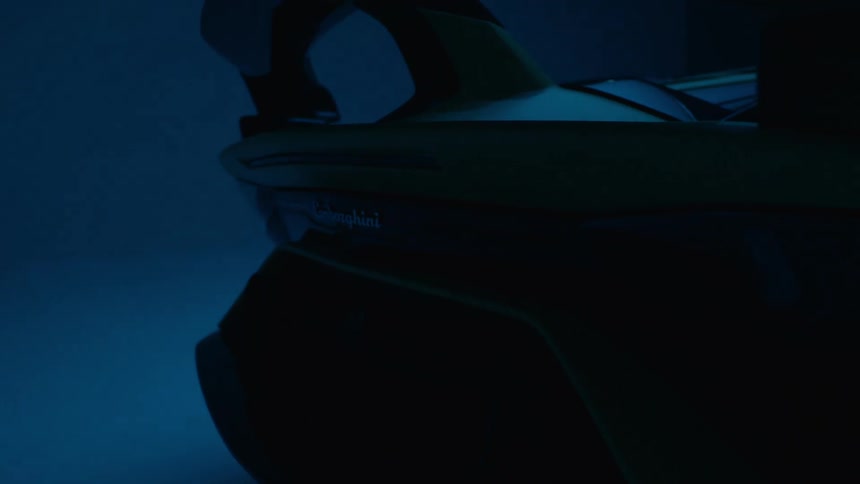 Blue lighting illuminates a lamborghini parked indoors