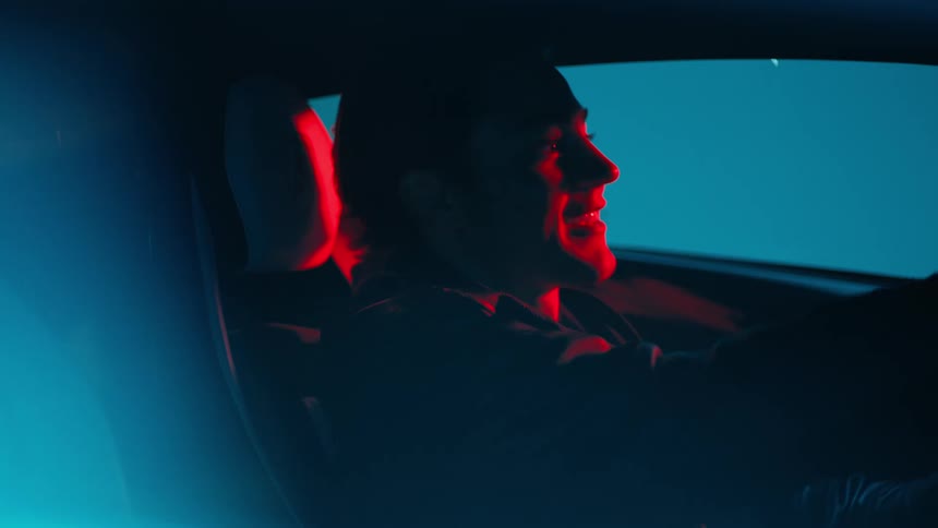 A man is talking in the car