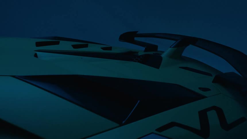 A room is lit up with a blue light and shows a luxury car