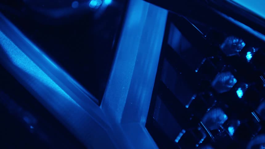 A close up of metal under a blue light