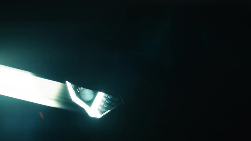 Lamborghini with headlights on in indoor environment