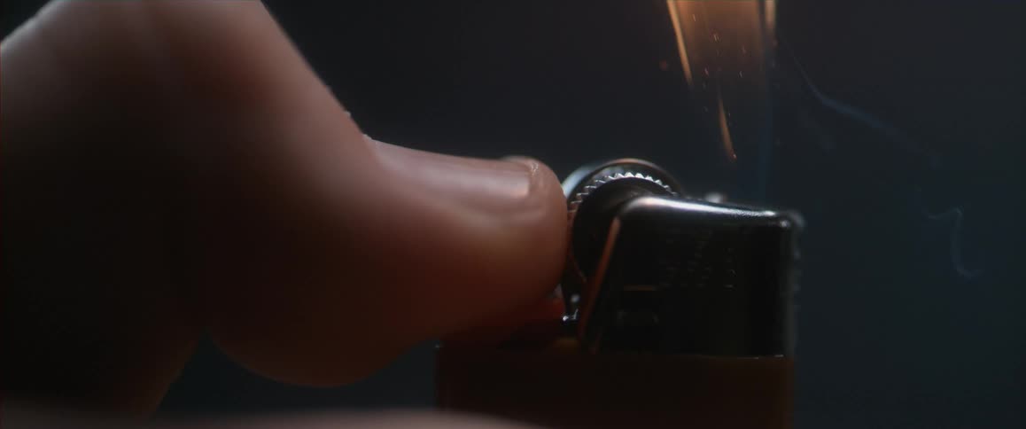 A person sparking a lighter