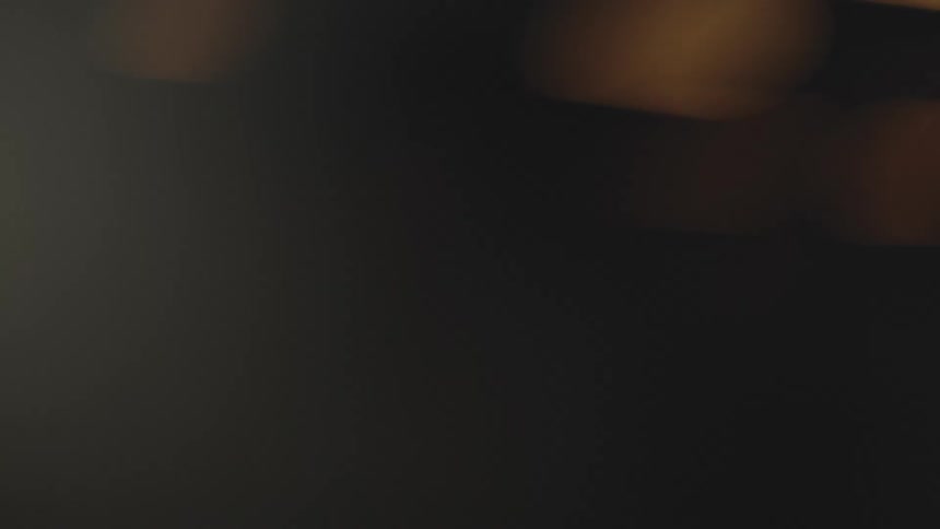 A machine with a rotating disk ejecting several bright orange sparks