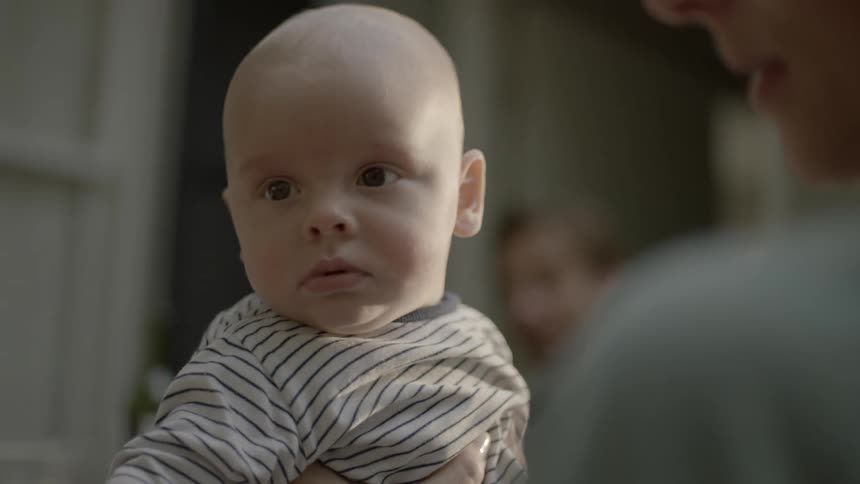 A person is holding a baby