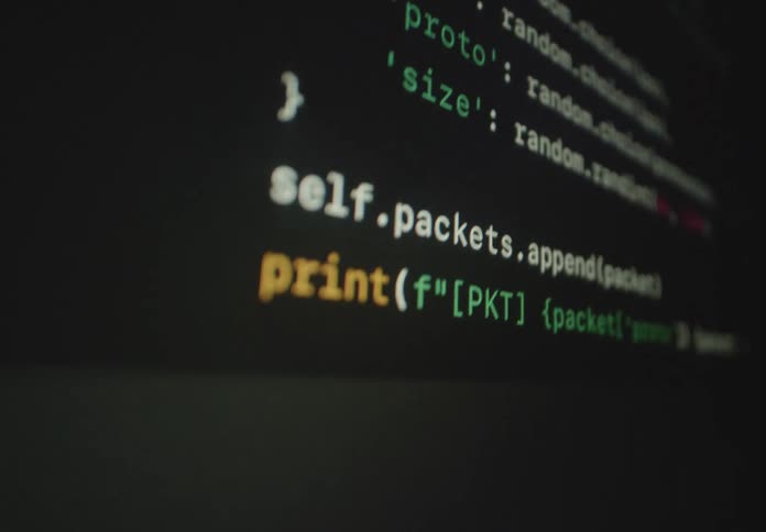 A computer program is running on a display showing a series of lines of code