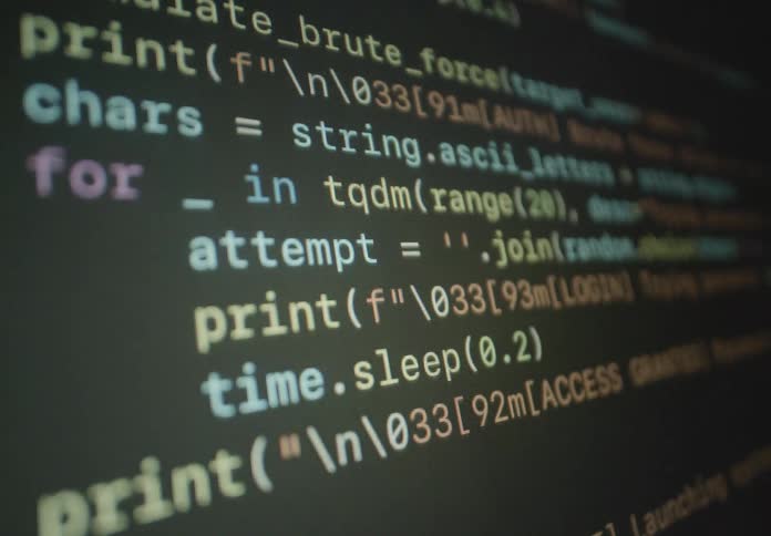 Code scrolls on the computer screen