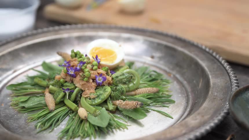 A nicely plated dish is on a silver tray