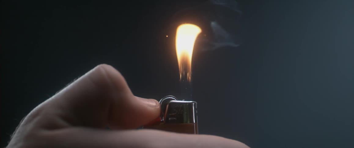 A person lighting a bic lighter