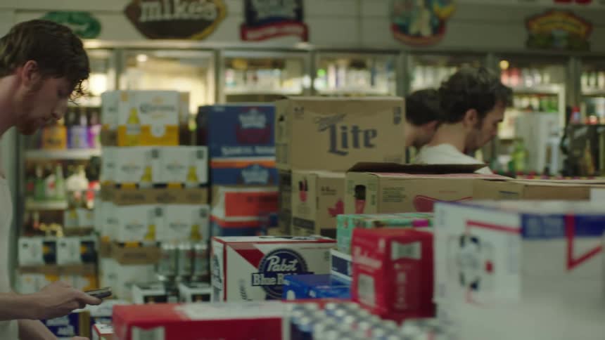 Three men in a liquor store