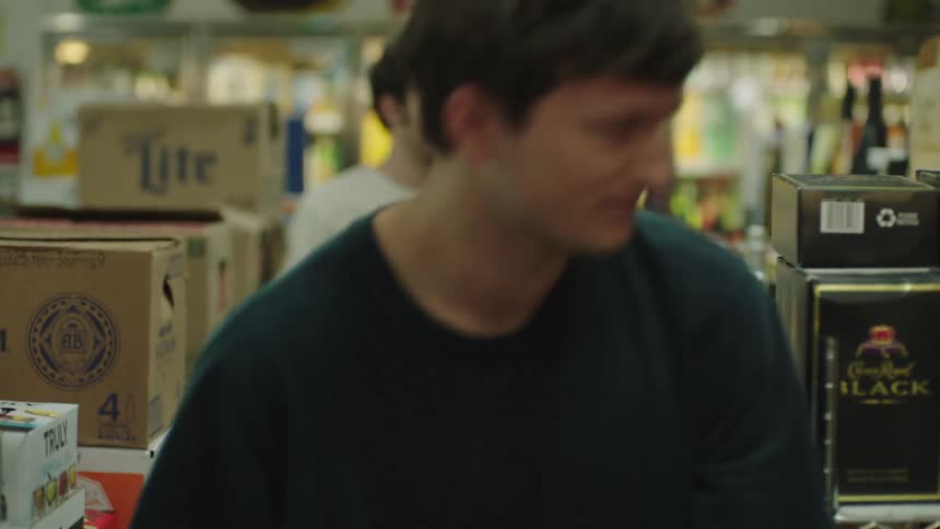 Three young men in a liquor store