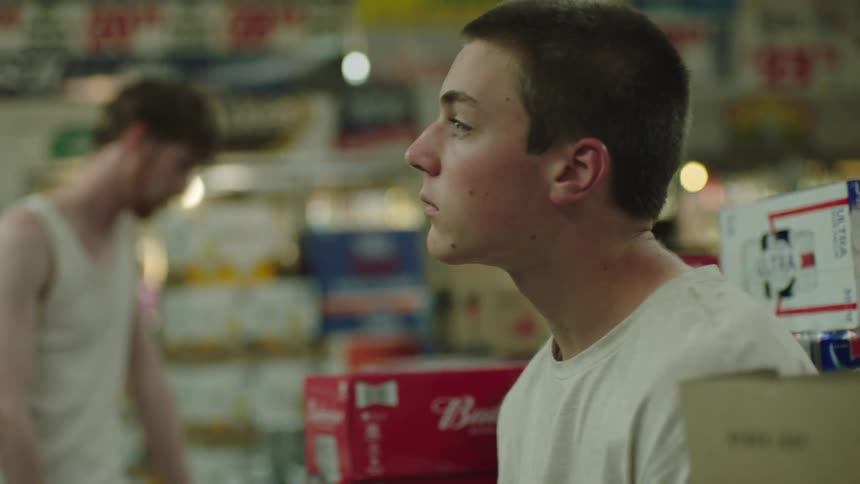 Two thoughtful teenagers in a liquor store