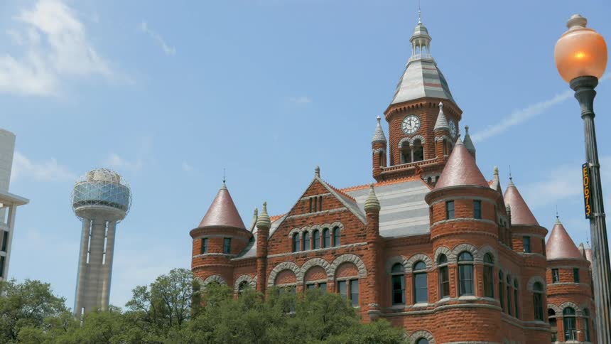 A view of the upper part of a building with sunny skies