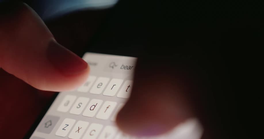 A person texts on their phone