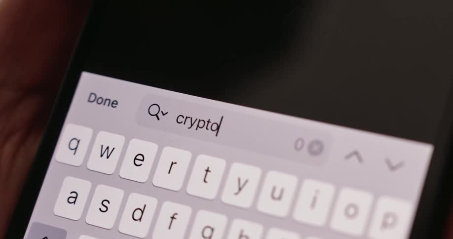 A person is typing on the cell phone keyboard