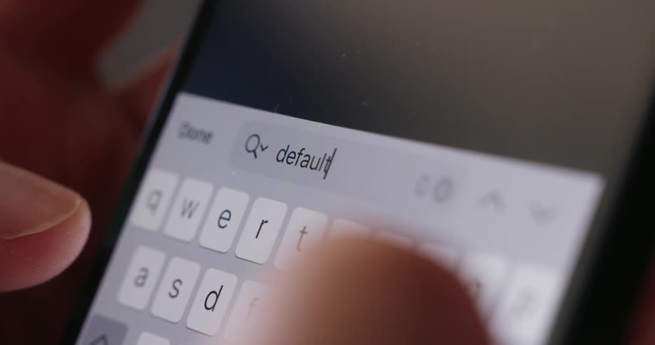 A search term is typed into the cell phone