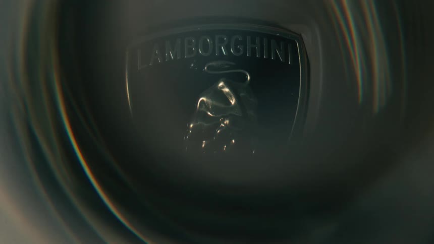 The lights spin in front of the lamborghini emblem on the car